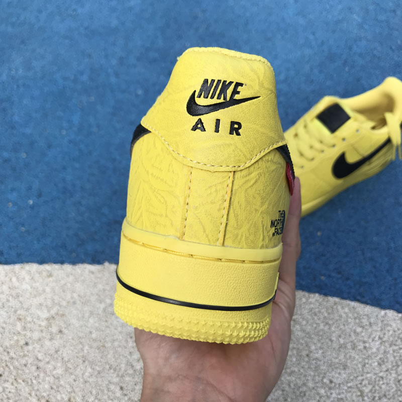 Supreme The North Face Nike Air Force 1 Sup AF1 Low Yellow Black AR3066-400 In Hand Heel Image Supreme The North Face Nike Air Force 1 Sup AF1 Low Yellow Black AR3066-400 In Hand Heel Image