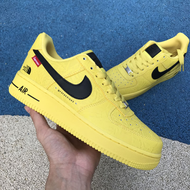 Supreme The North Face Nike Air Force 1 Sup AF1 Low Yellow Black AR3066-400 In Hand Lateral Image Supreme The North Face Nike Air Force 1 Sup AF1 Low Yellow Black AR3066-400 In Hand Lateral Image