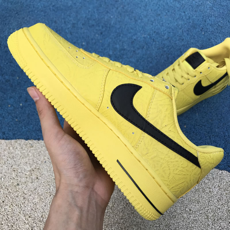 Supreme The North Face Nike Air Force 1 Sup AF1 Low Yellow Black AR3066-400 In Hand Medial Image Supreme The North Face Nike Air Force 1 Sup AF1 Low Yellow Black AR3066-400 In Hand Medial Image