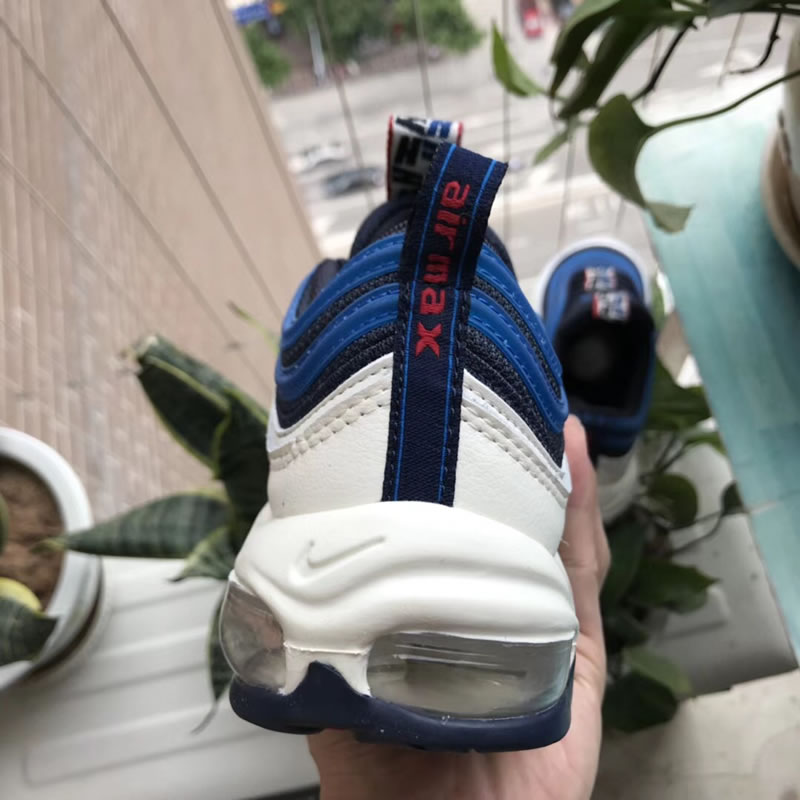 Nike Air Max Plus 97 TT SE Obsidian/Blue/University Red For Sale In Hand Behind Image Nike Air Max Plus 97 TT SE Obsidian/Blue/University Red For Sale In Hand Behind Image